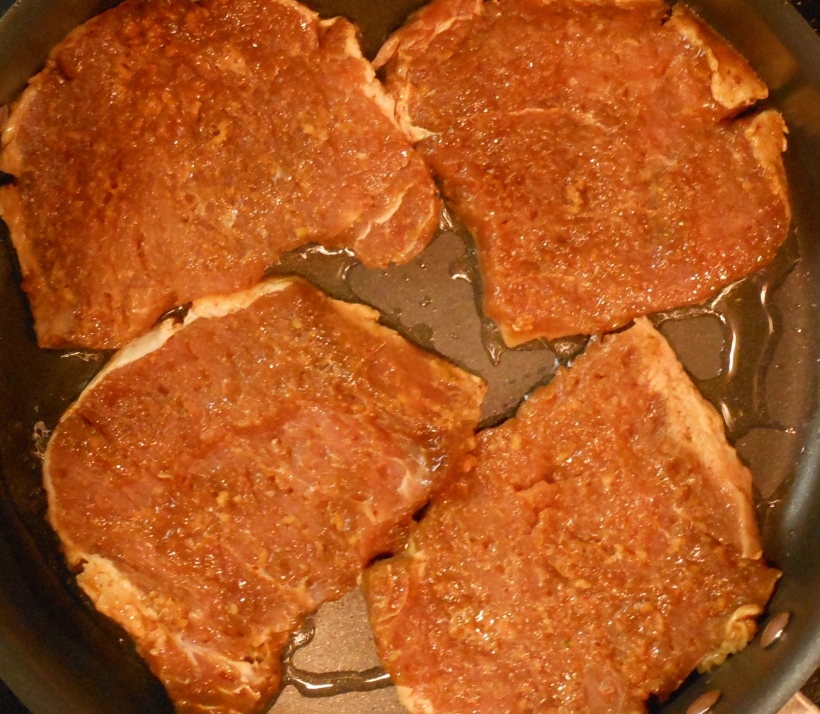 Next, I put oil into a frying pan and turned the heat on high.  In went the chops.